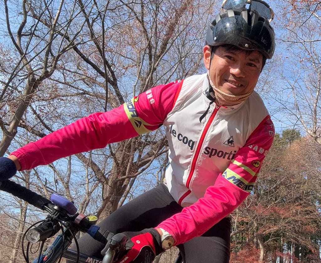 休日にサイクリングを楽しむクリーニングアンジェの店長